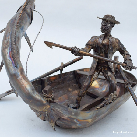Fisherman fishing on a boat - steel sculpture
